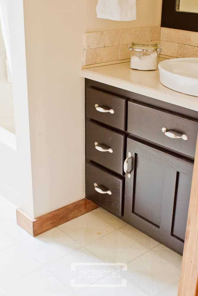 small bathroom vanity showing old floor before a small bathroom makeover