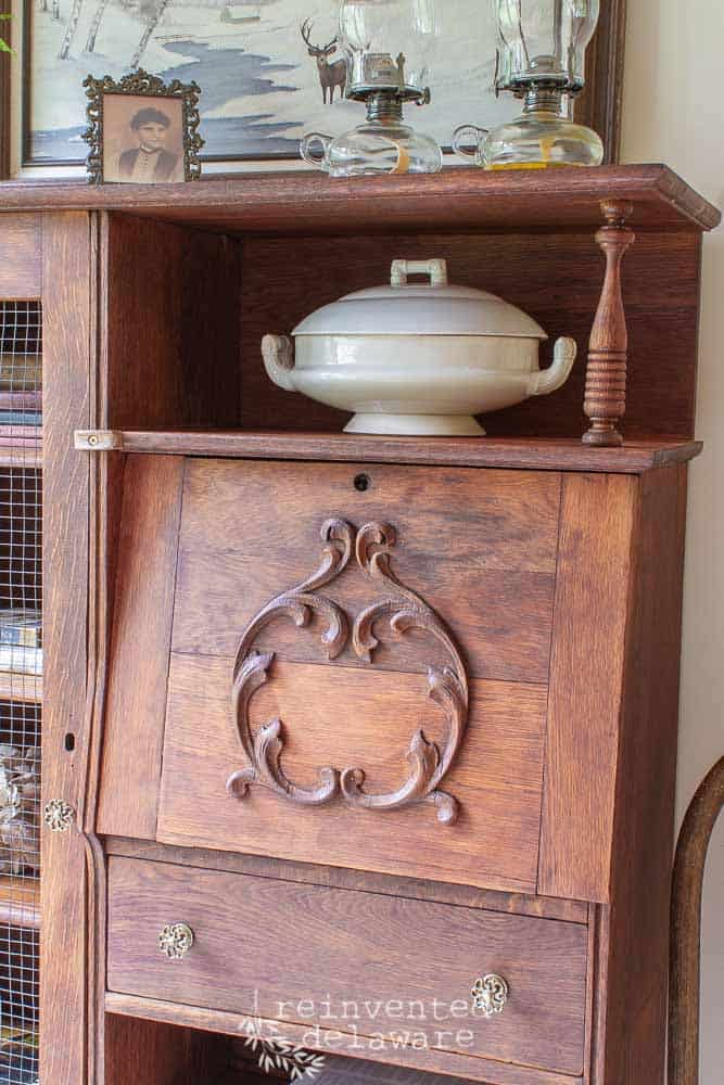 secretary desk close up of wood carved detail