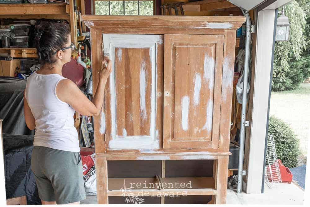 applying Zinsser Shellac Primer to TV cabinet