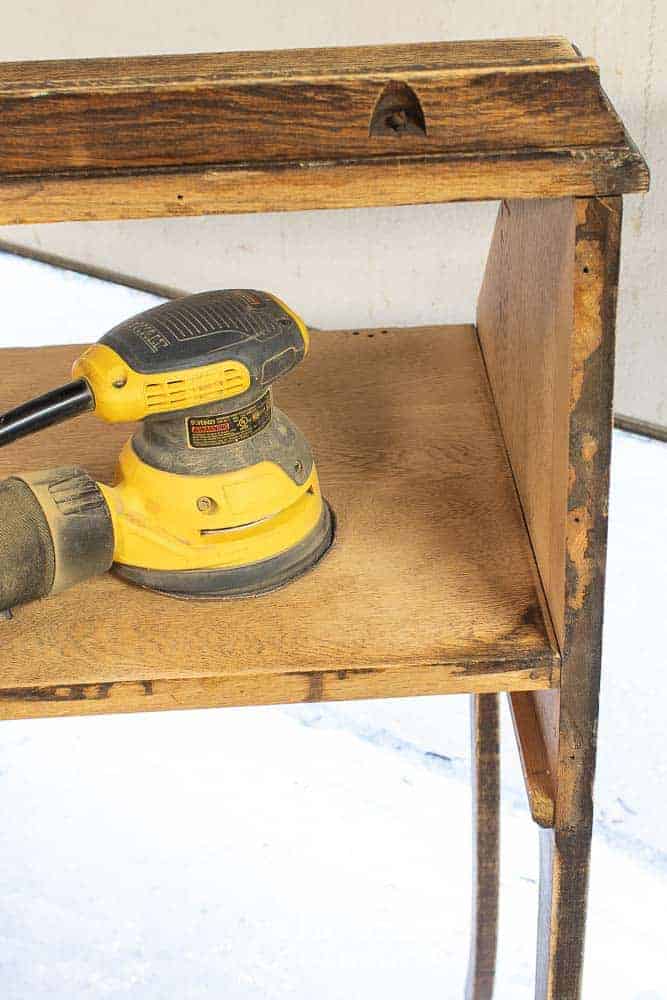 DeWalt orbital sander on top of fold down secretary desk