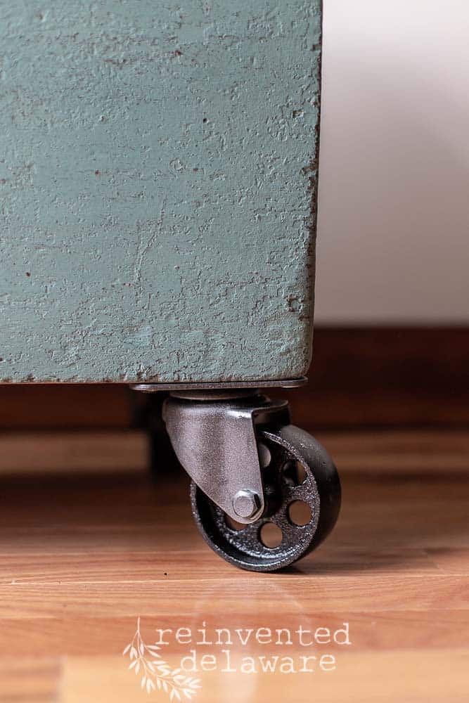 old wooden tool box after transformation in MMS Kitchen Scale showing painted casters up close