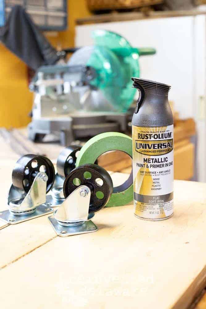 Spray painting caster wheels for wood tool box decorating idea.