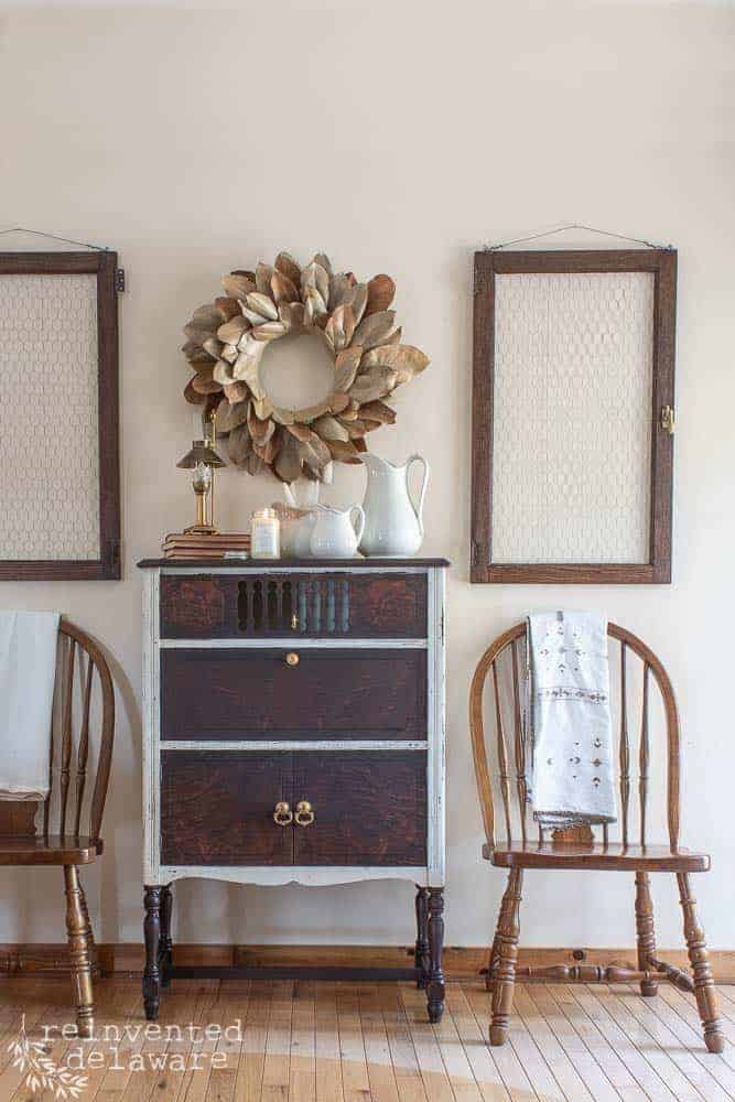 Last time we looked at this antique cabinet it had been prepped, sanded, painted, and sealed. Now it's time to see the furniture makeover before and after! #vintagefarmhouse #vintagehomedecor #paintedfurniturelove