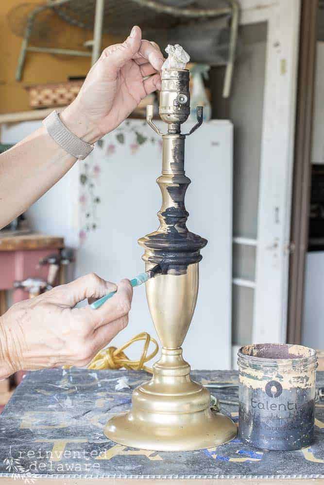 brass lamp being painted with milk paint for easy lamp makeover project