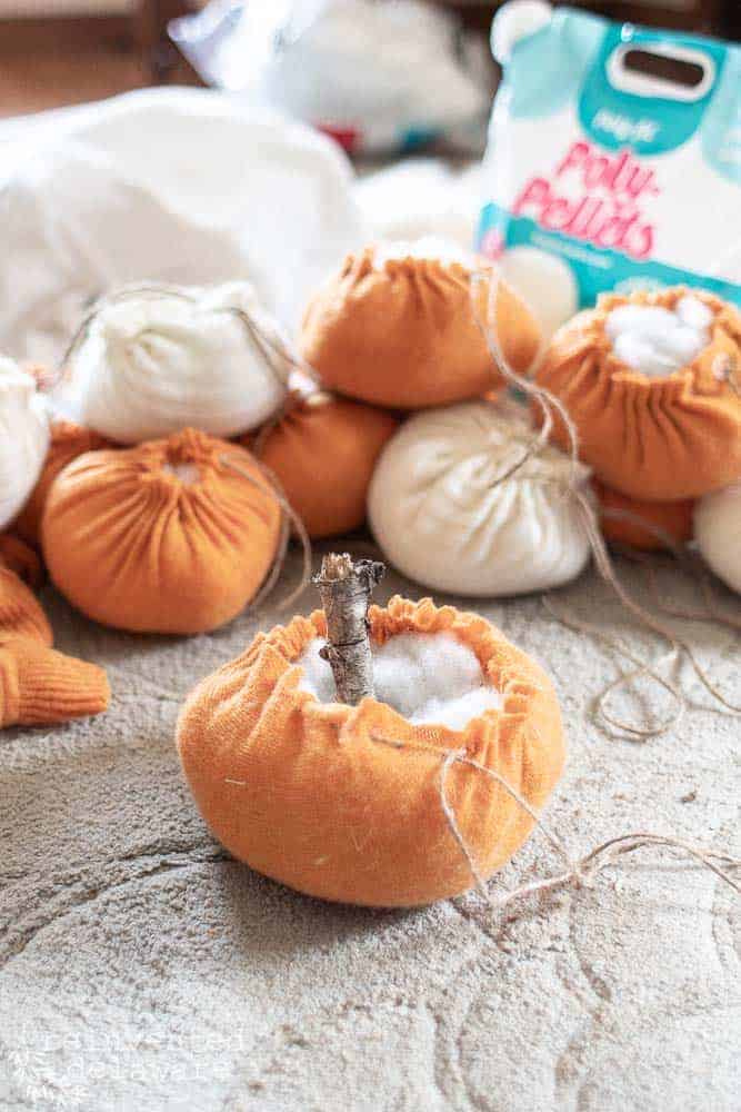 fabrtic pumpkins being stuffed with Poly fill