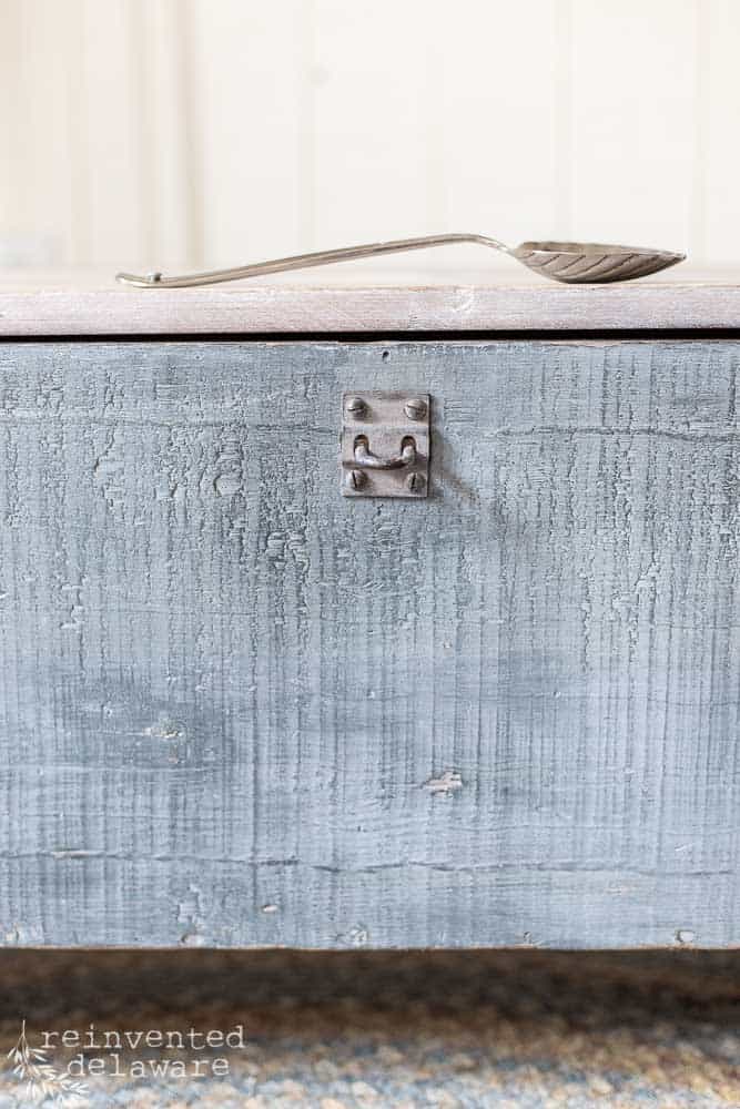 close up of original lock on vintage wood toolbox