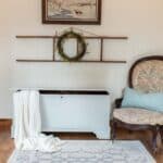 blanket chest after being painted in Miss Mustard Seed Milk Paint Mora staged with home decor