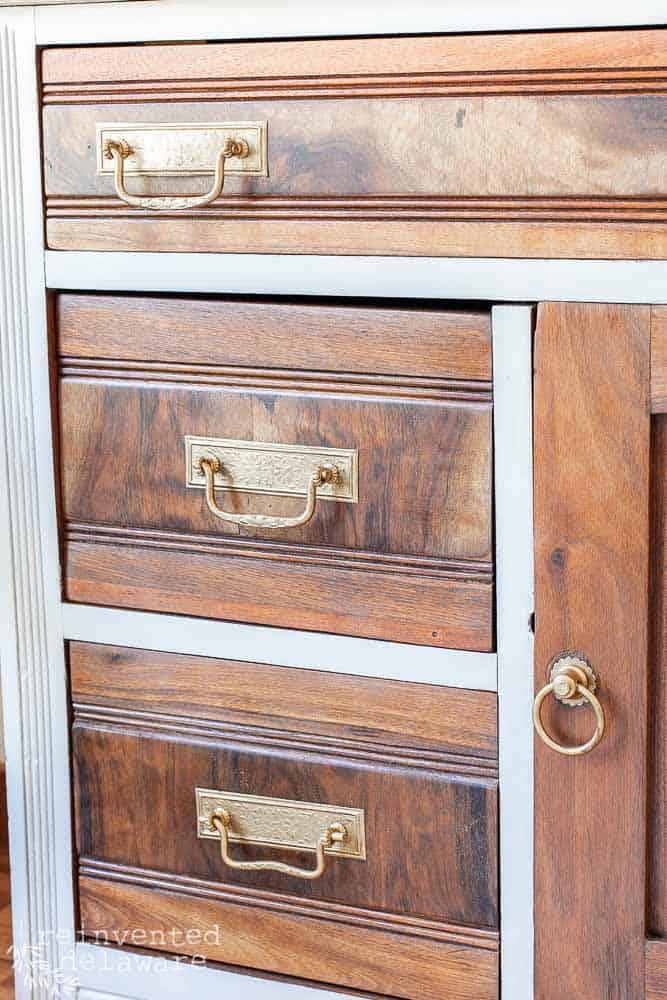 antique washstand makeover showing drawer pulls that have been restored with Rub n Buff