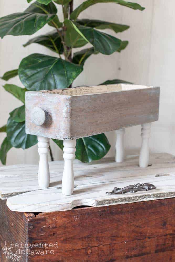 antique sewing table drawer repurposed with spindles as table top organizer