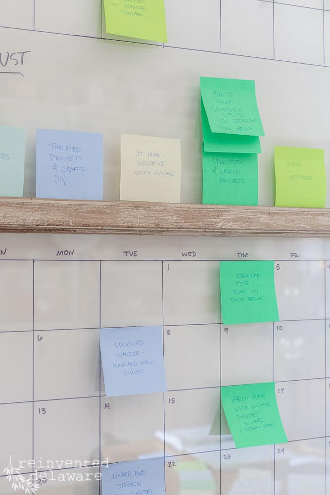 post it notes on a vintage window used as a large content calendar for bloggers and YouTubers