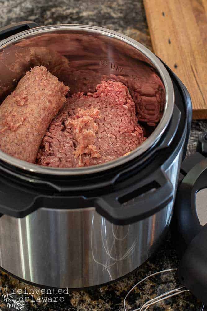 Instant Pot filled with ground beef and ground sausage