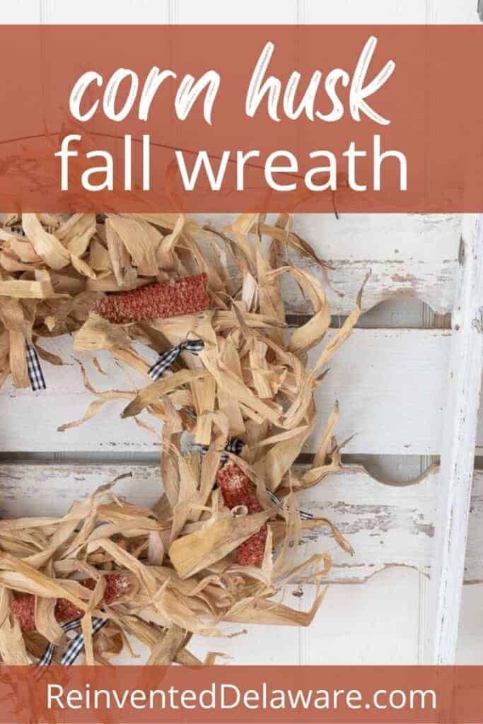 Pinterest graphic with text overlay saying $5 corn husk fall wreath and ReinventedDelaware.com at the bottom with photo of staged scene including the corn husk wreath
