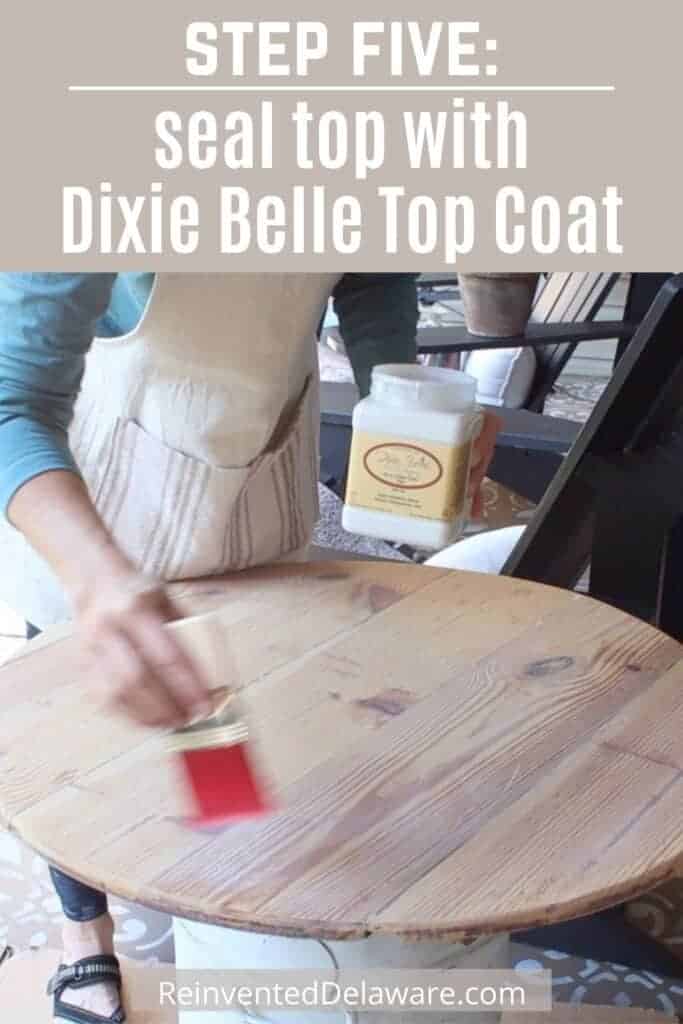 Graphic with text overlay: "Step Five: seal top with Dixie Belle Top Coat" with lady applying top coat to wood table top.
