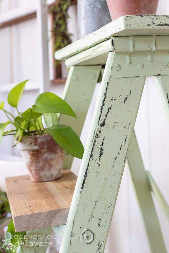 Side view and close up of chippy paint finish using Dixie Belle Paint on a repurposed step ladder.