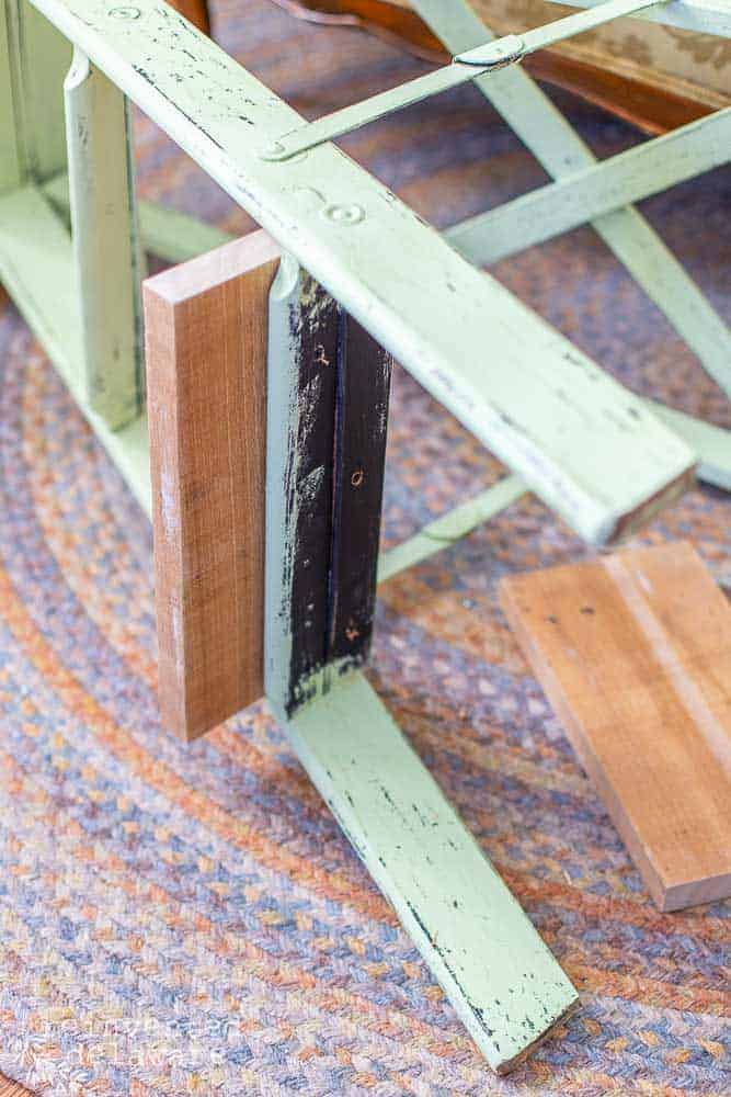 Pieces of wood used to repair the broken steps on an upcycled step ladder.