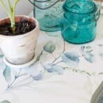Close up of peel and stick wallpaper applied to an end table for a furniture makeover tutorial.