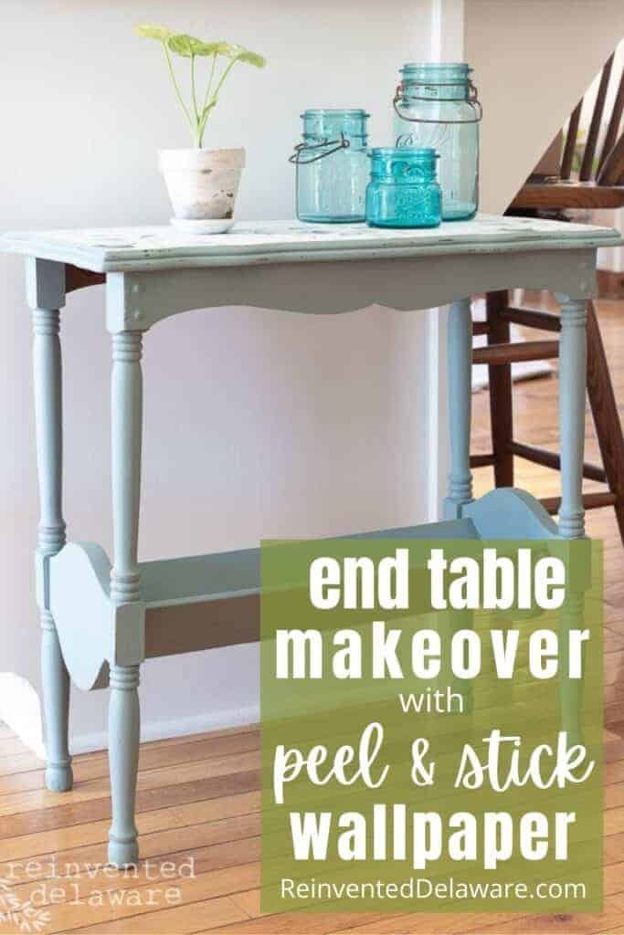 Pinterest graphic with text overlay "end table makeover with peel and stick wallpaper ReinventedDelaware.com" with finished side table in the background.