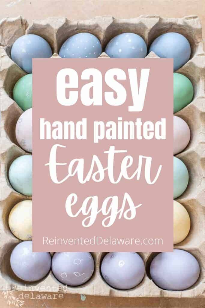 Pinterest graphic with text overlay "easy hand painted Easter eggs ReinventedDelaware.com" with an image of painted wooden eggs in the background.