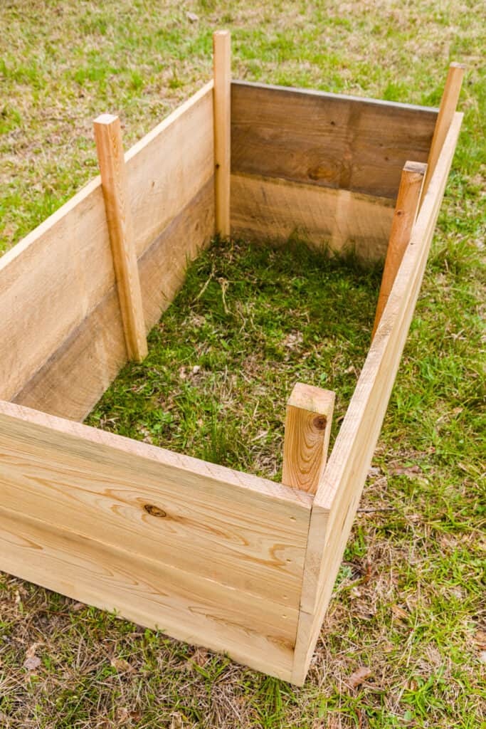 Raised garden bed built with lumber.