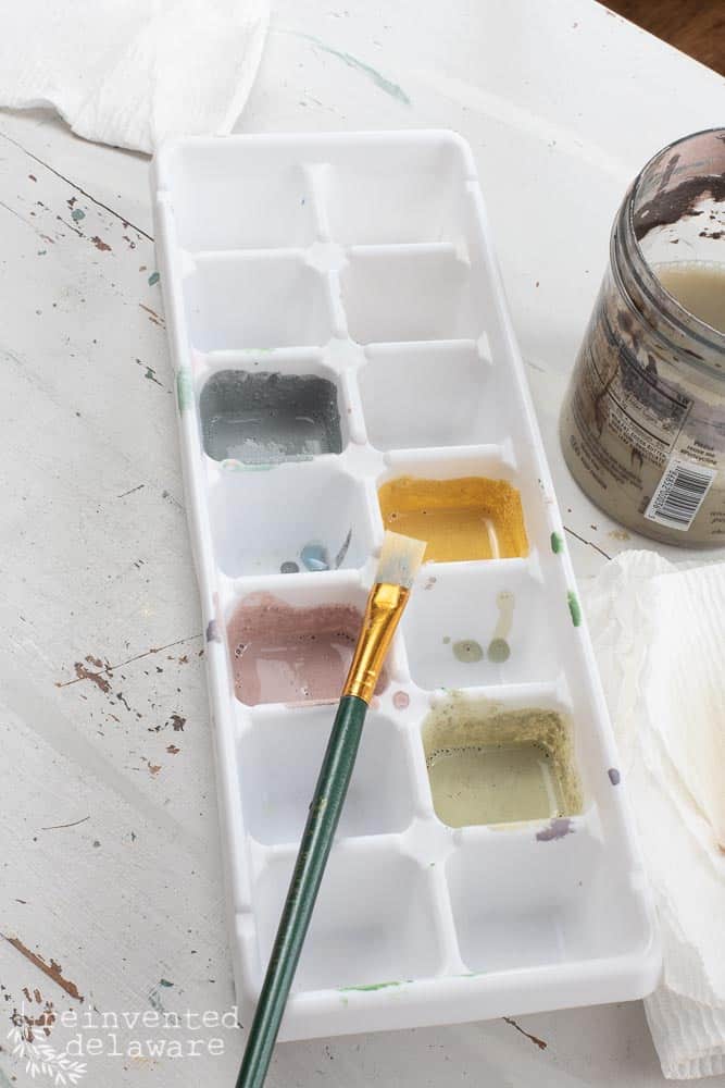 An ice tray filled with a variety of milk paint colors by Miss Mustard Seeds Milk Paint.