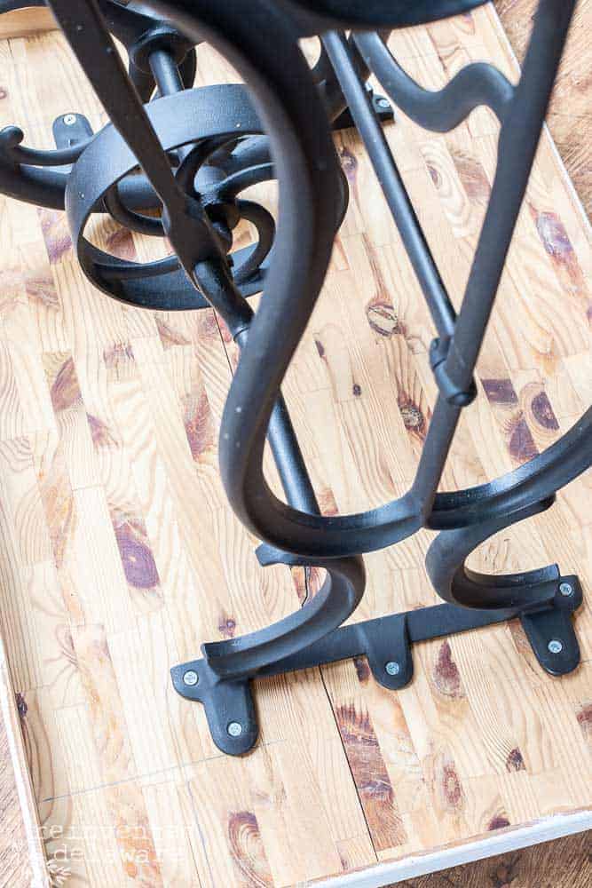 The underside of a sewing cabinet cast iron base turned into a craft table idea.