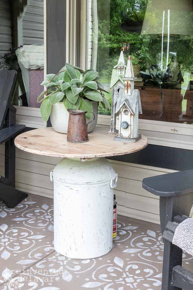 Vintage Milk Can table on front porch makeover.