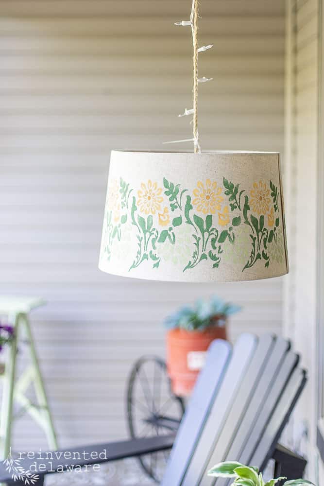 Upcycled lampshade makeover idea used at a front porch hanging light.