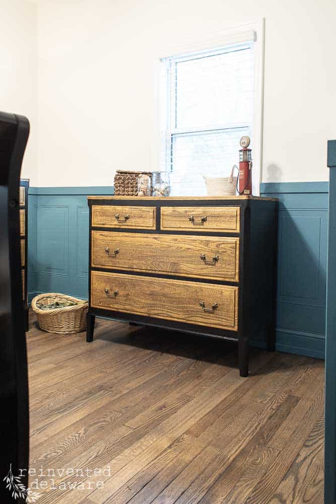 Four drawer antique dresser that was painted black using Dixie Belle products.