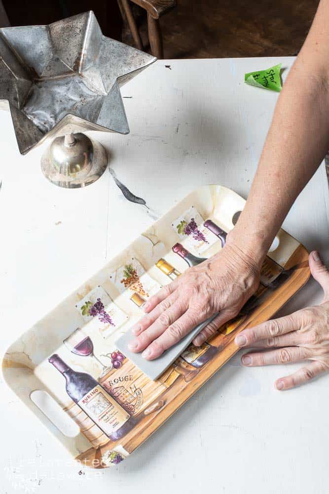 Lady using Surf Prep RAD Pads to scuff sand a melamine serving tray.