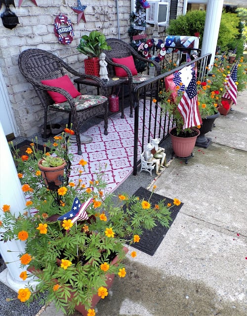 Front porch with patriotic home decor.