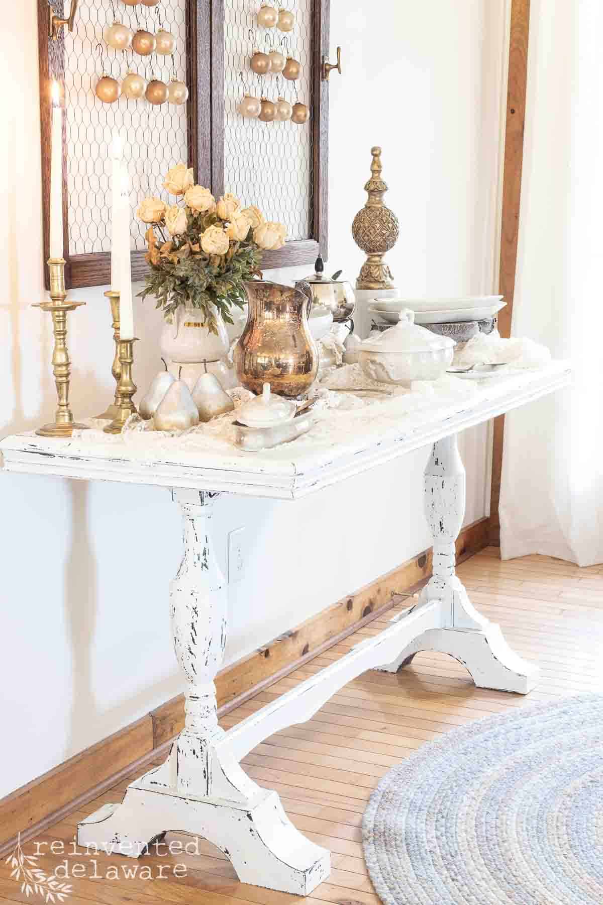 antique table with vintage tablescape pieces for the holidays