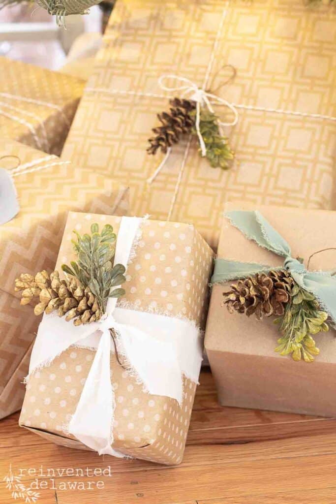 gift wrapping ideas for Christmas with brown craft papr and pine cones