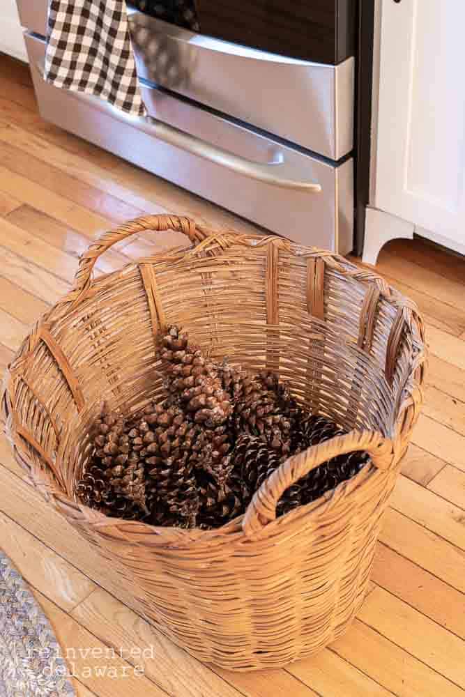 wicker basket full of pinecones