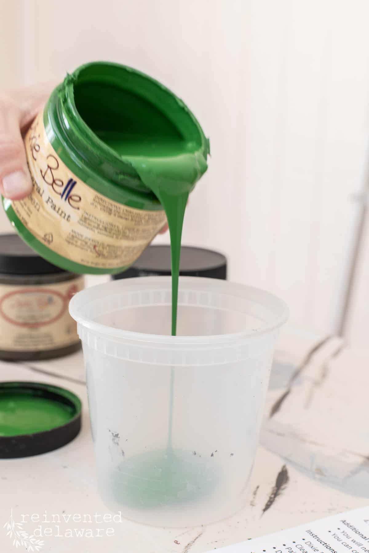 pouring chalk paint into container
