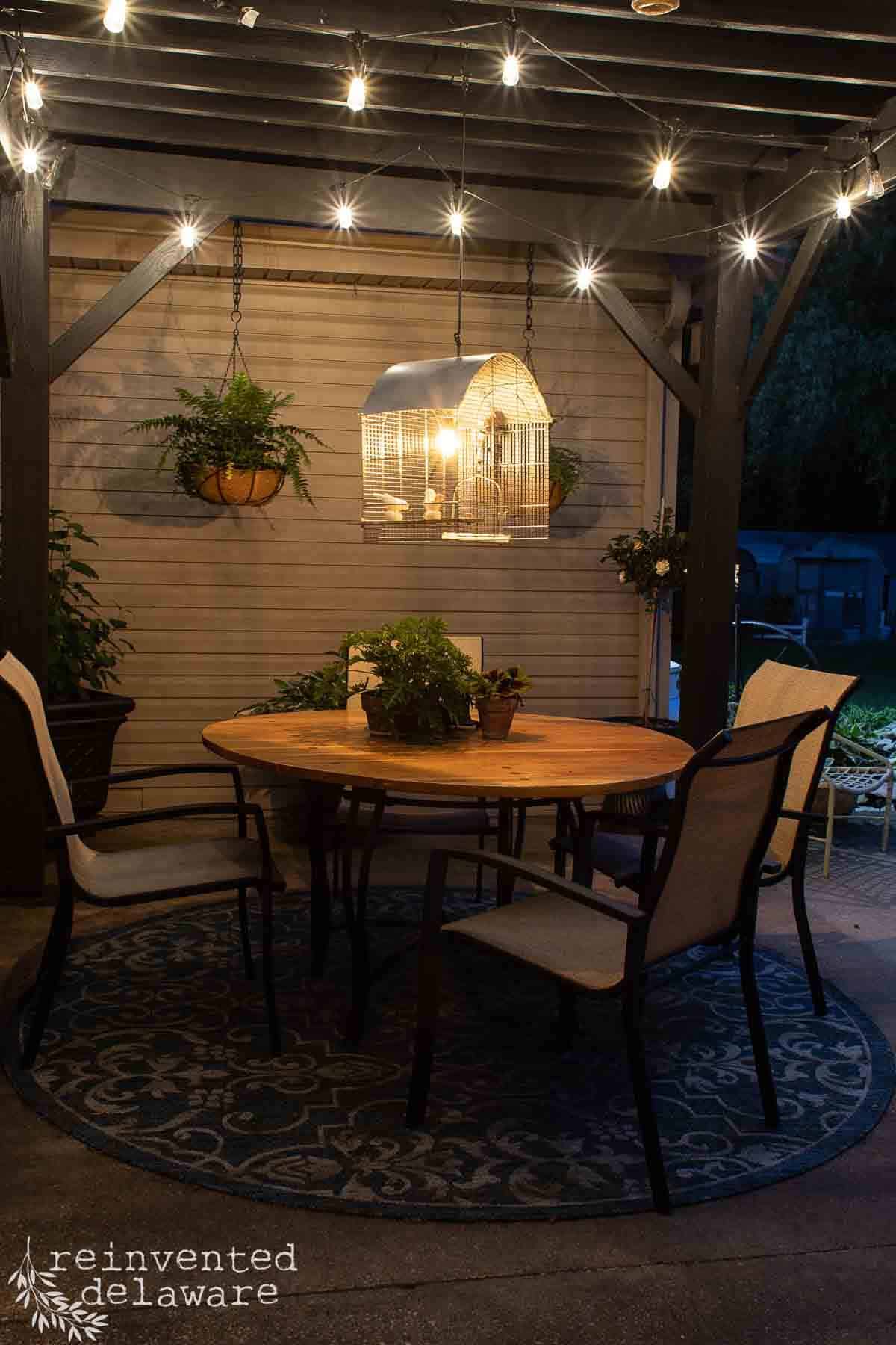 night scene of upcycled planters on a backyard patio
