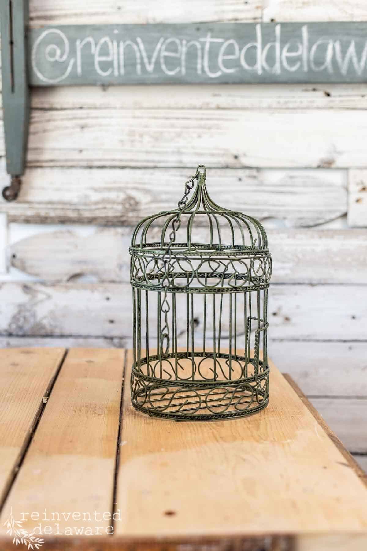 small birdcage from a local thrift store used in upcycled home decor for spring