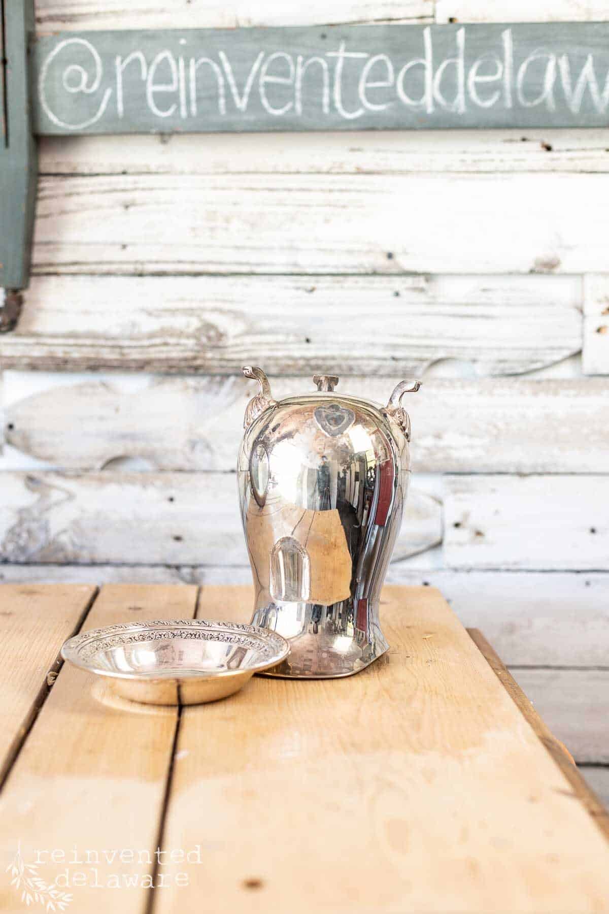 vintage silver plate pitcher with broken parts ready for a thrift store flip project