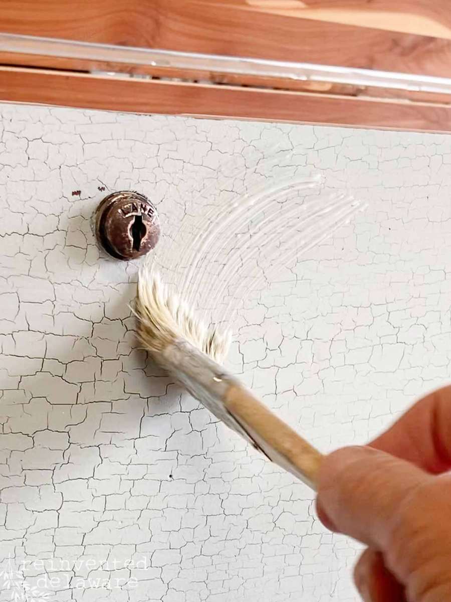lady applying furniture wax to an old cedar chest3