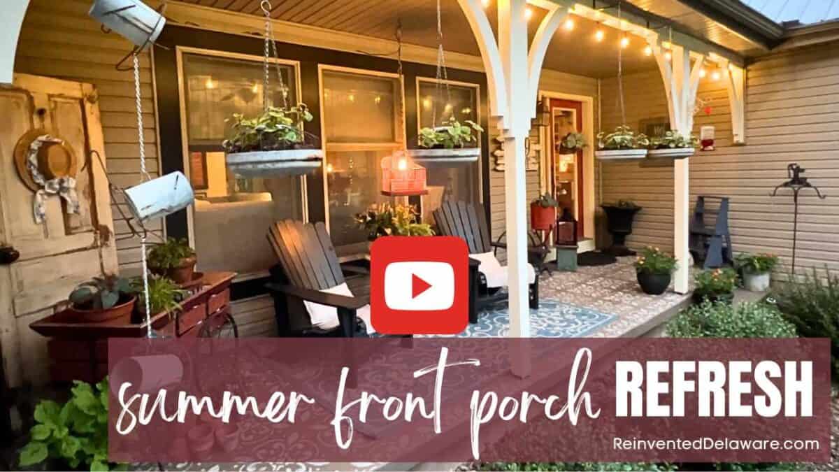 Cozy front porch with hanging plants, Adirondack chairs, warm lighting, a patterned rug, and summer décor—perfect for relaxing along the journey. Text overlay: "summer front porch REFRESH" and "ReinventedDelaware.com".