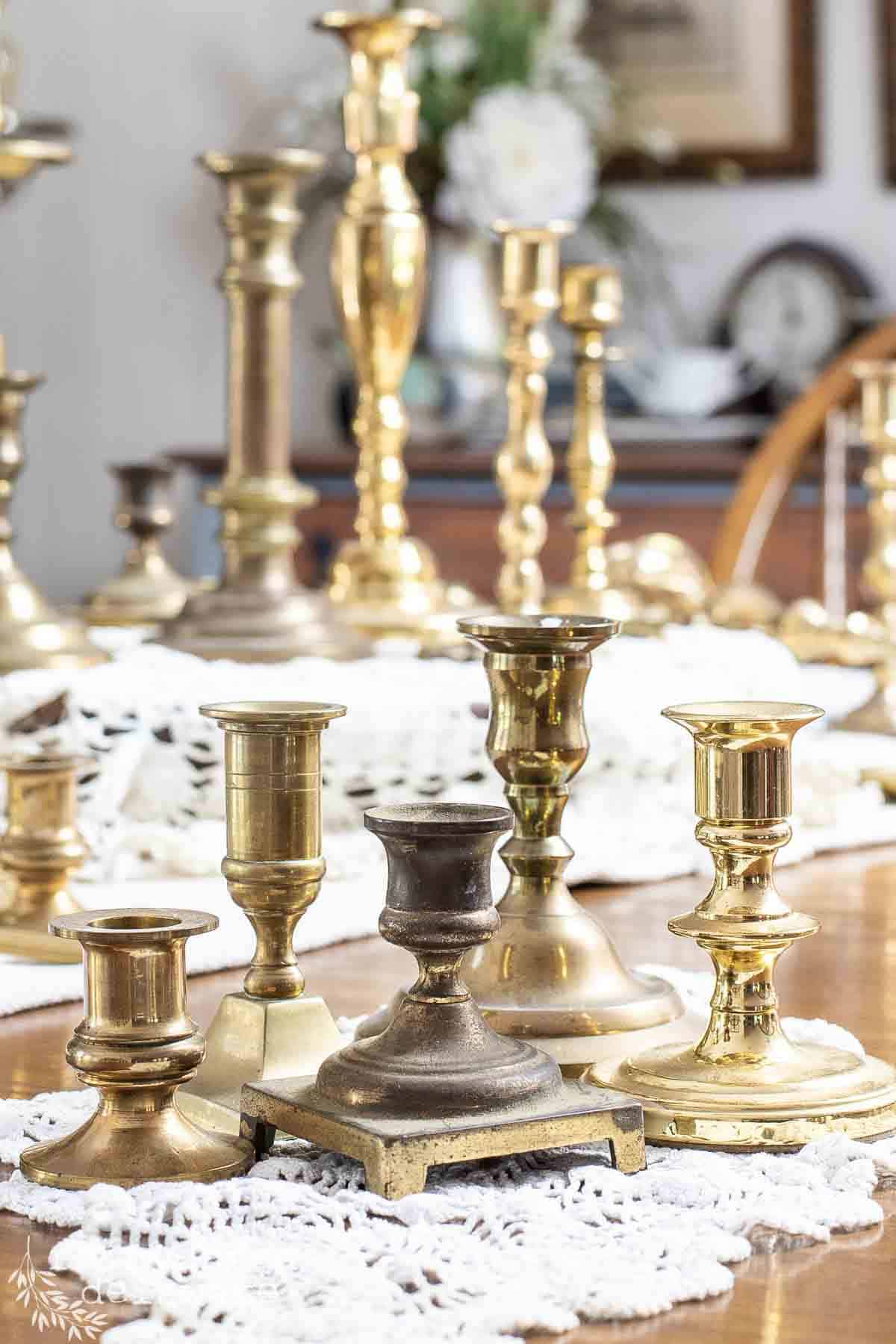 several real brass candlesticks