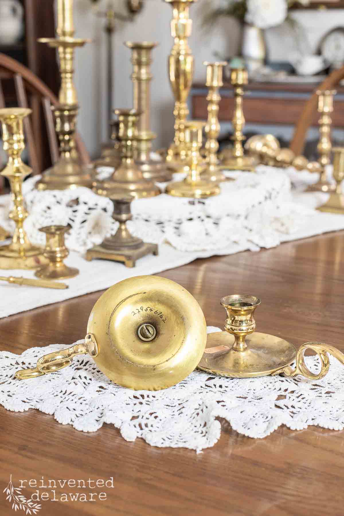 underside of brass candlestick showing markings