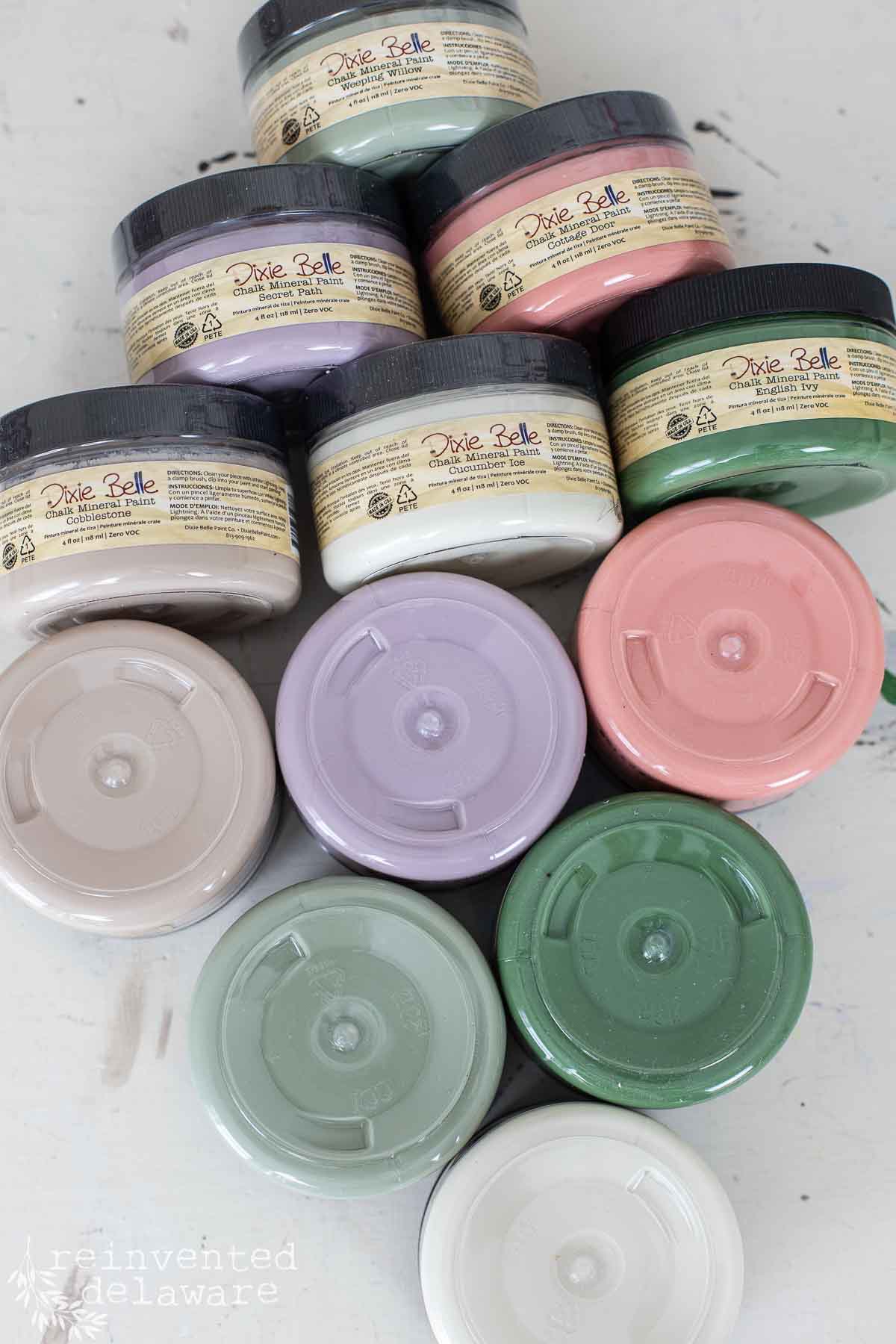 paint jars laying on their side to show new cottage colors