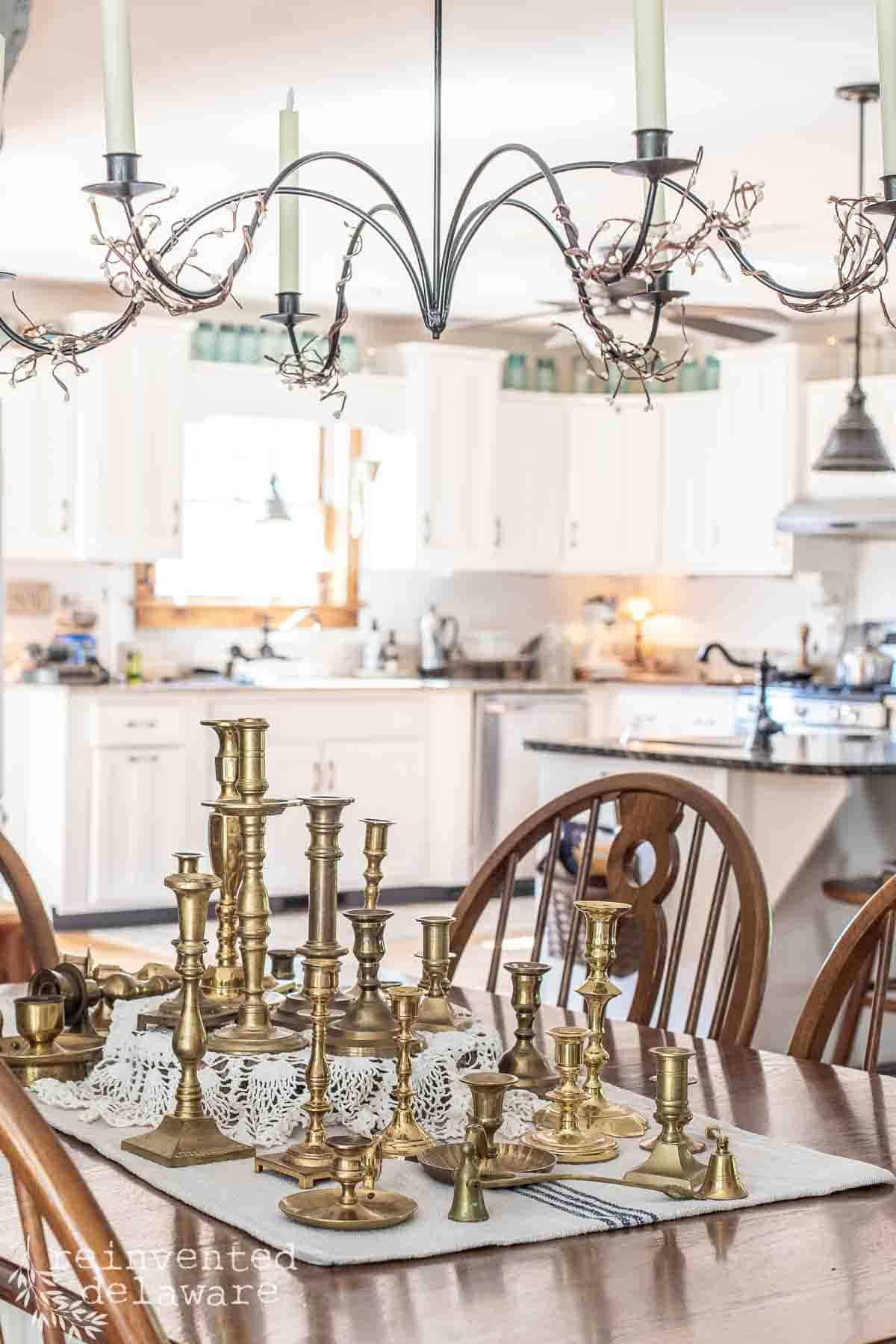 variety of vintage and antique brass candlesticks used as home decor
