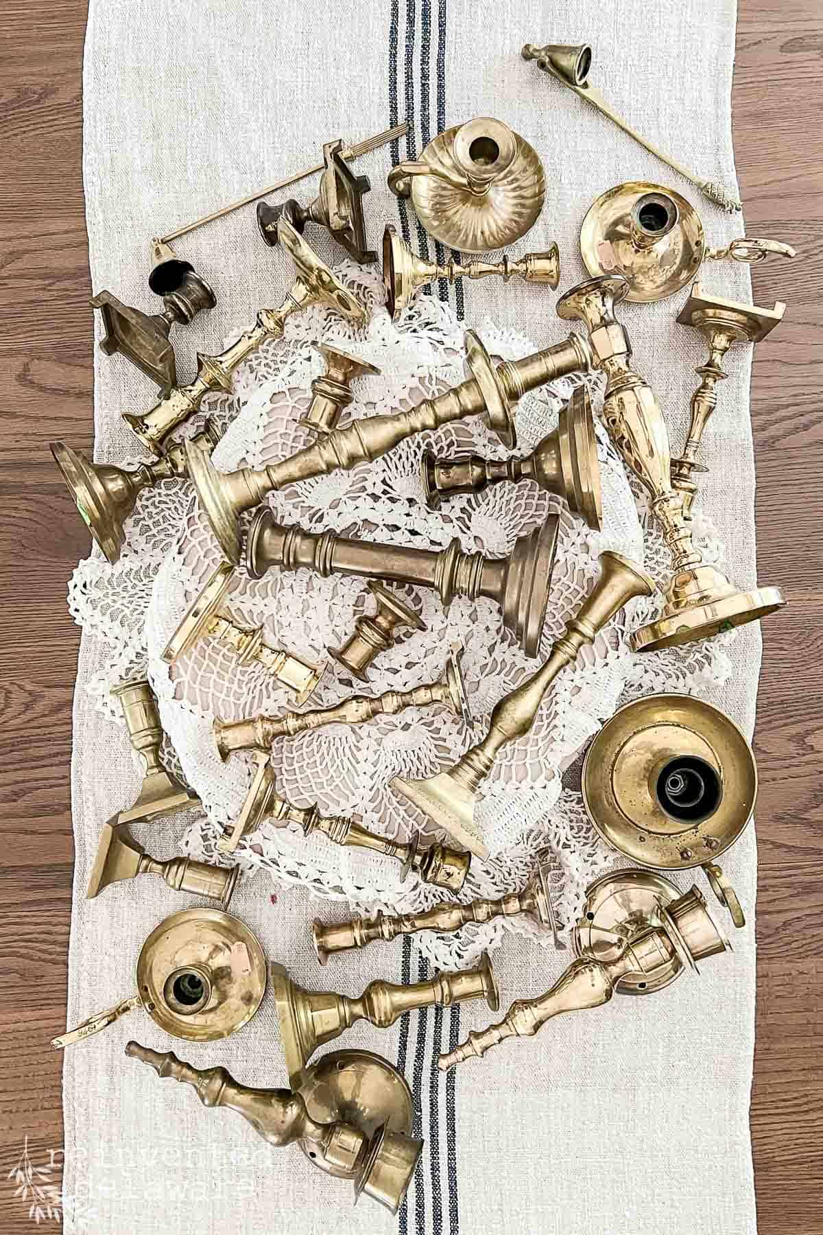 Top view of a variety of brass candlesticks used as home decor