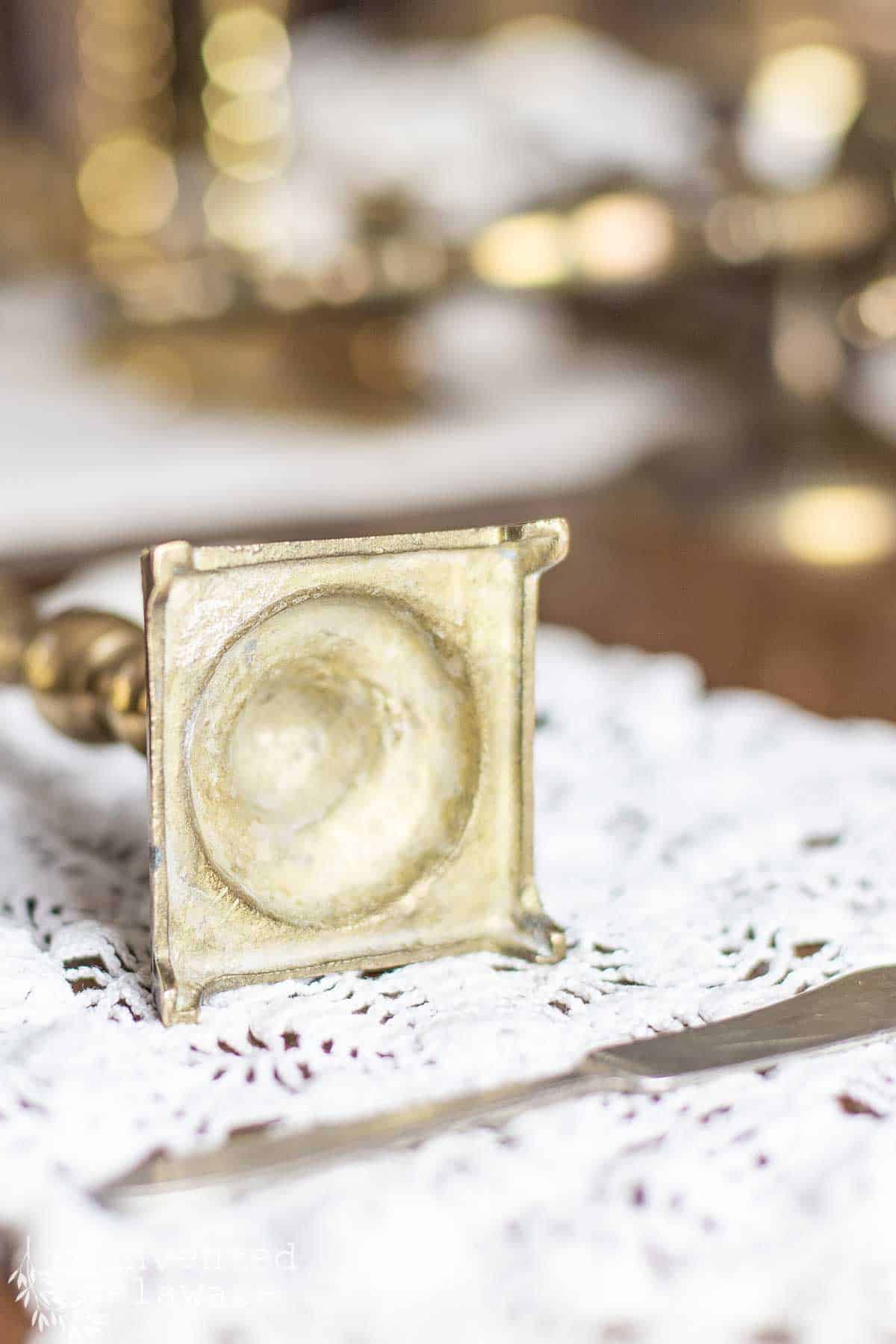 example of the scratch test to distinguish real brass