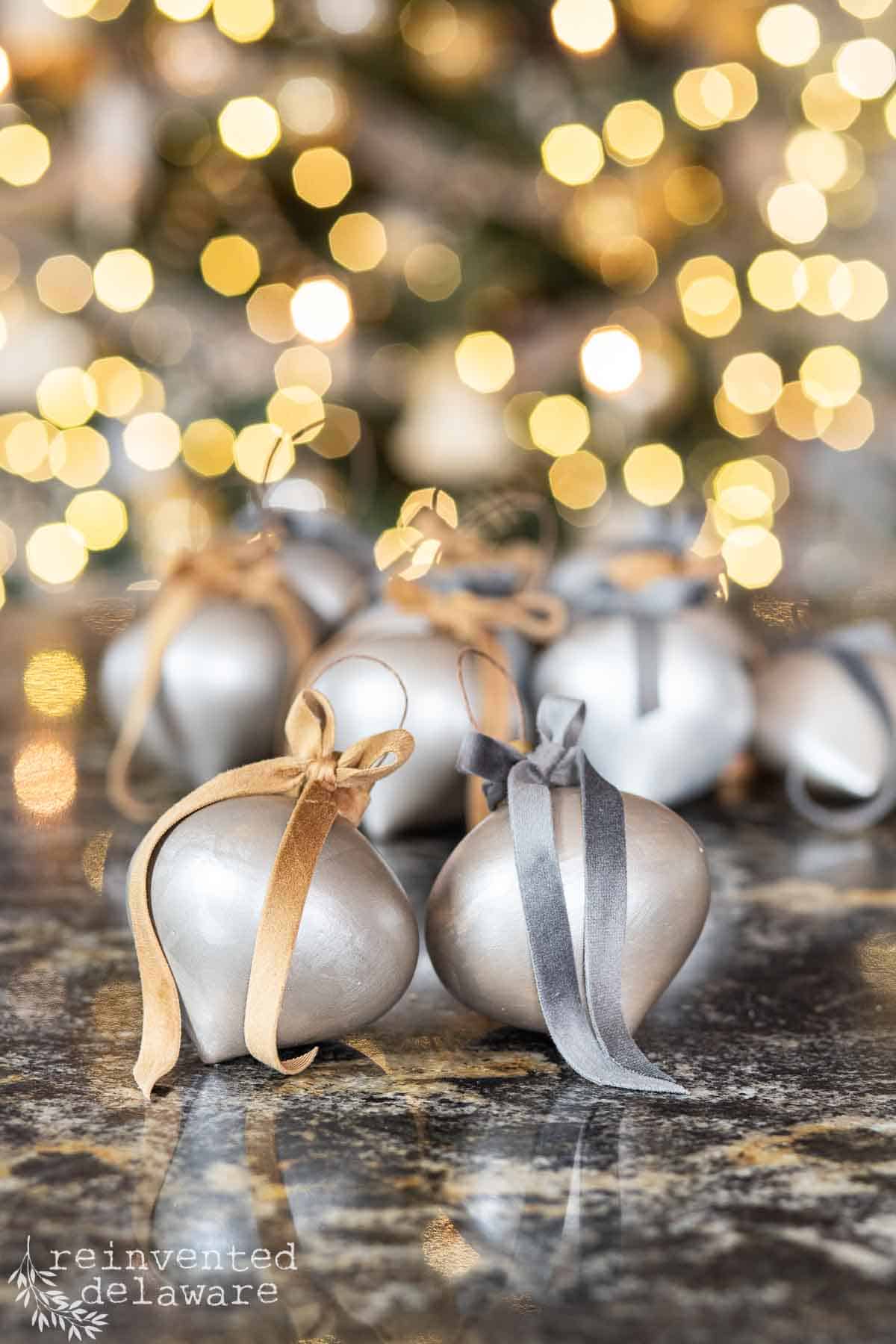 DIY painted ceramic Christmas ball ornaments in silver and gold