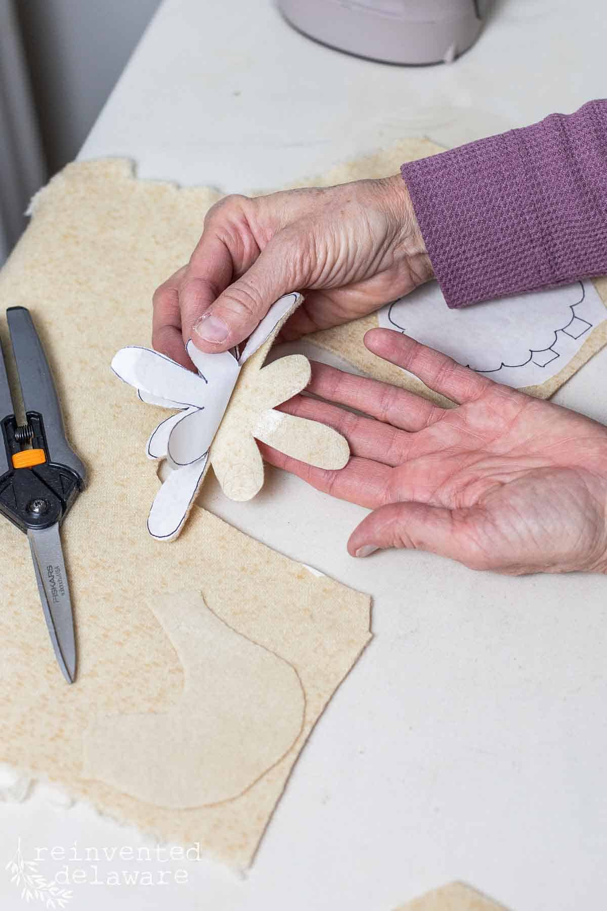 iron on adhesive on the back of a diy ornament project