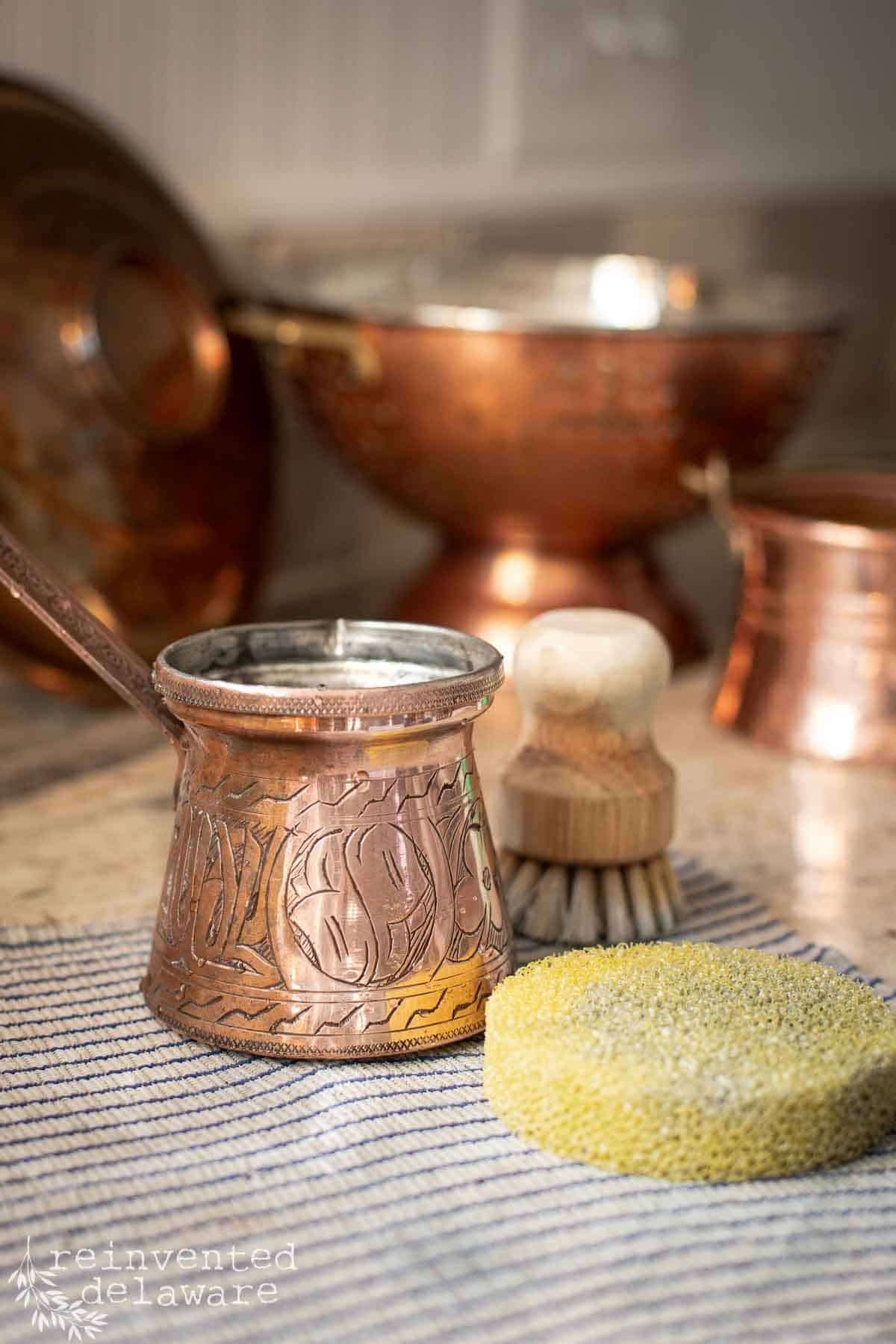 small copper Turkish coffee maker cleaned with a copper polish