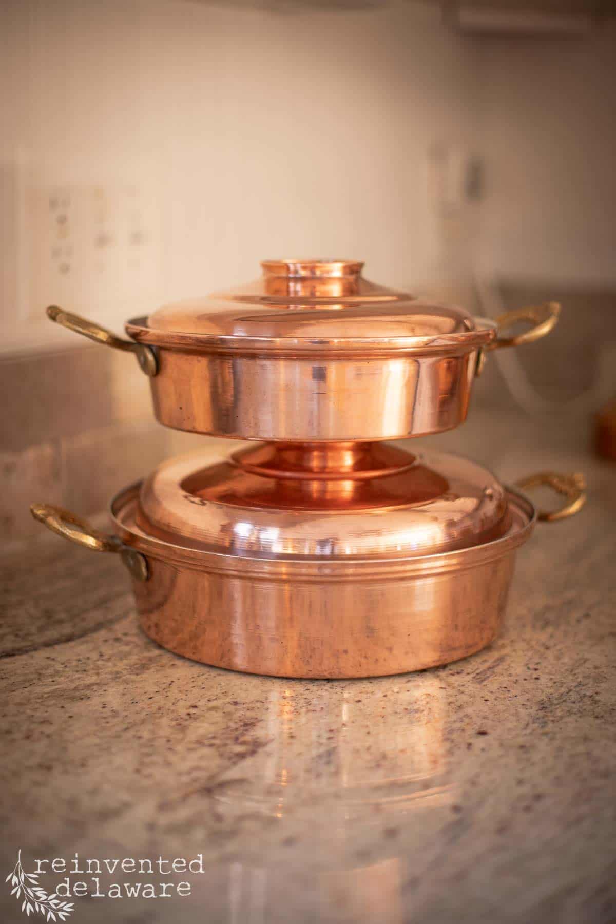 copper cookware that was burnt and is now clean, polished and shiny