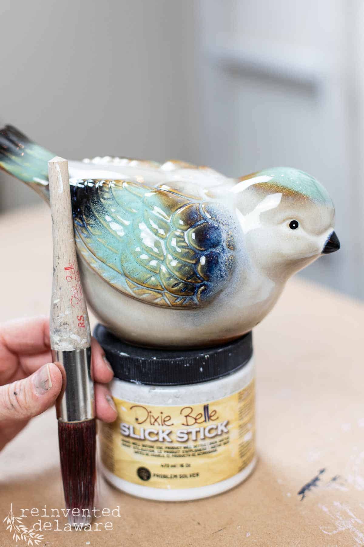 ceramic bird before being painted to create a concrete look instead of the original shiny finish